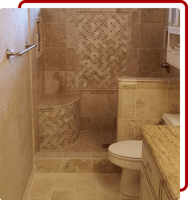 A bathroom with tile walls and floors, a toilet and sink.