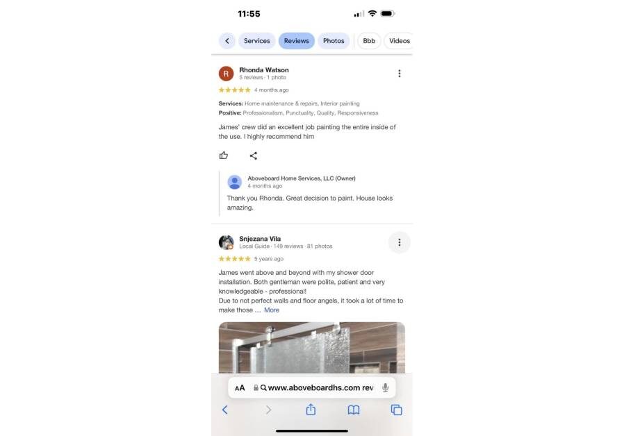 A phone with some of the google reviews displayed.